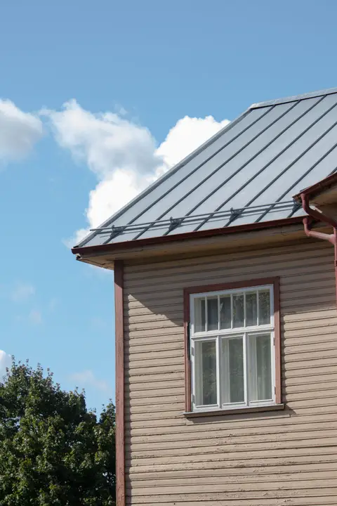 Metal roof on a wood-sided house