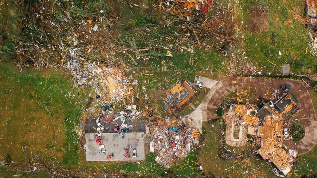Aerial view of a destroyed home and scattered debris